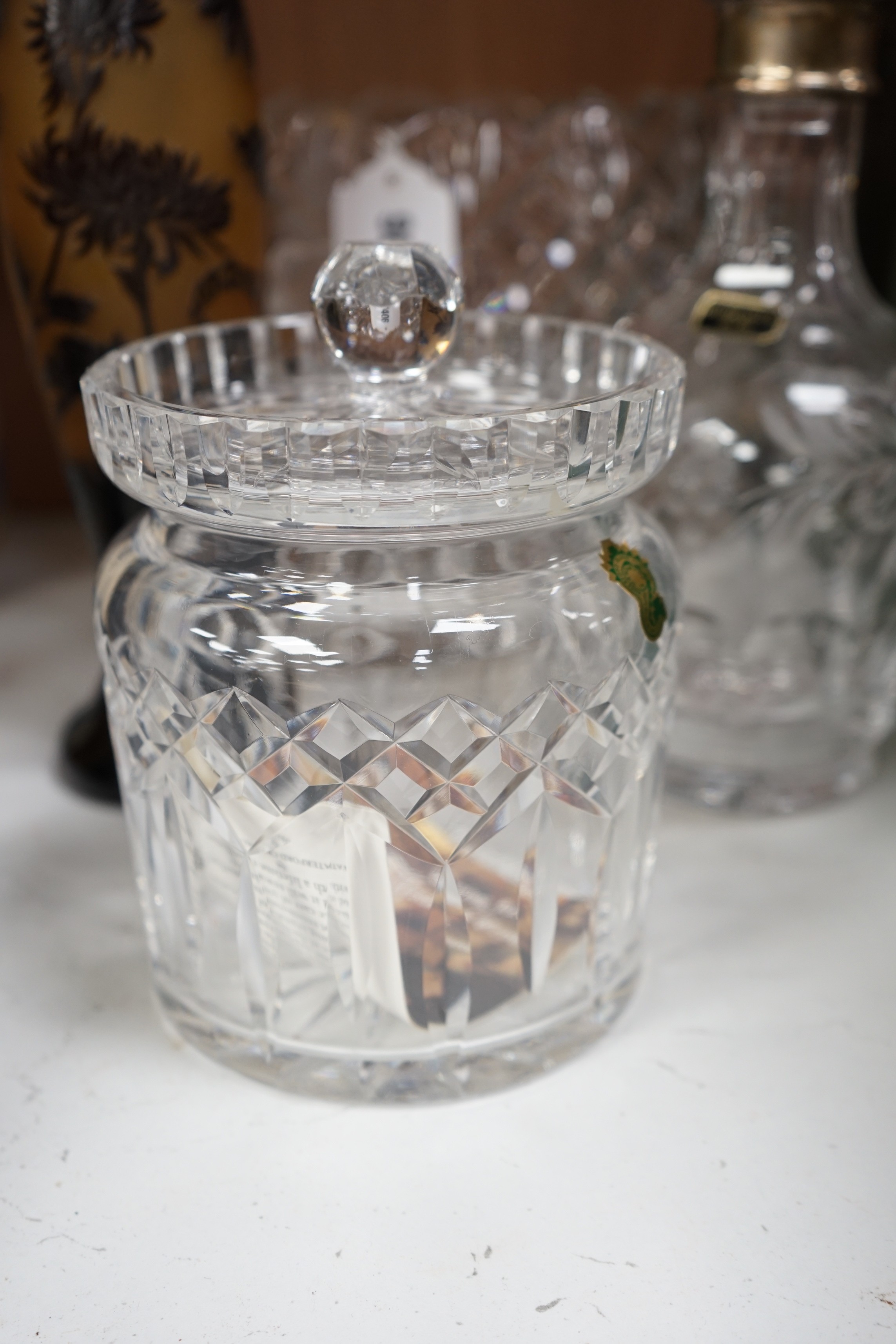 A large Waterford bowl, a biscuit barrel, a decanter with silver neck mount, boxed (Walter Davies) and a Galle style vase, decanter 29cms high